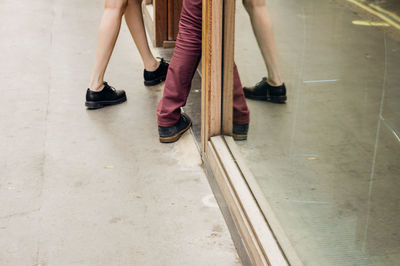 Low section of man standing on floor