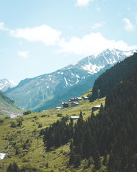 Scenic view of landscape and mountains against sky