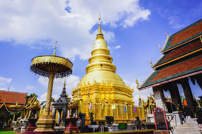 Low angle view of pagoda against buildings