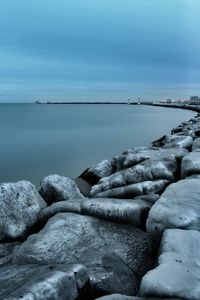 Scenic view of sea against cloudy sky