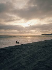 Scenic view of sea against cloudy sky