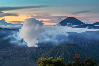 Scenic view of volcanic bromo mountain against sky during sunset