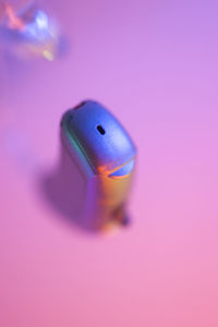 Close-up of a toy against pink background