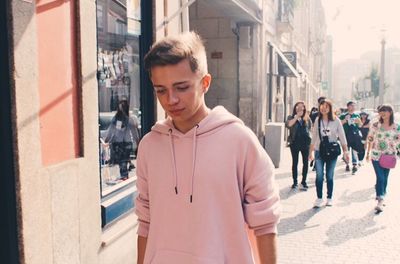 Young couple standing on street in city