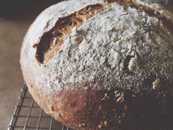 Close-up of homemade bread on metal grate