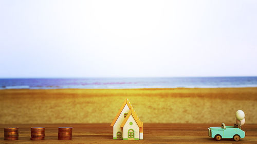 Lifeguard hut on beach against clear sky