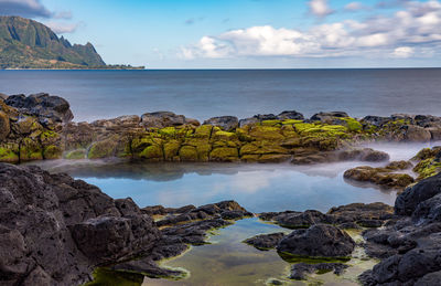 Long exposure of the calm waters of queen's bath, a rock pool off princeville on north of kauai