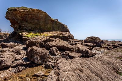 Rock formation on land against sky