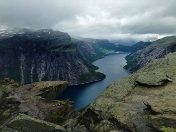 Scenic view of lake and mountains against sky