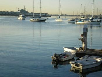 Boats moored at harbor