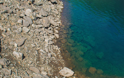 High angle view of pebbles on beach