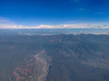 Aerial view of dramatic landscape against sky