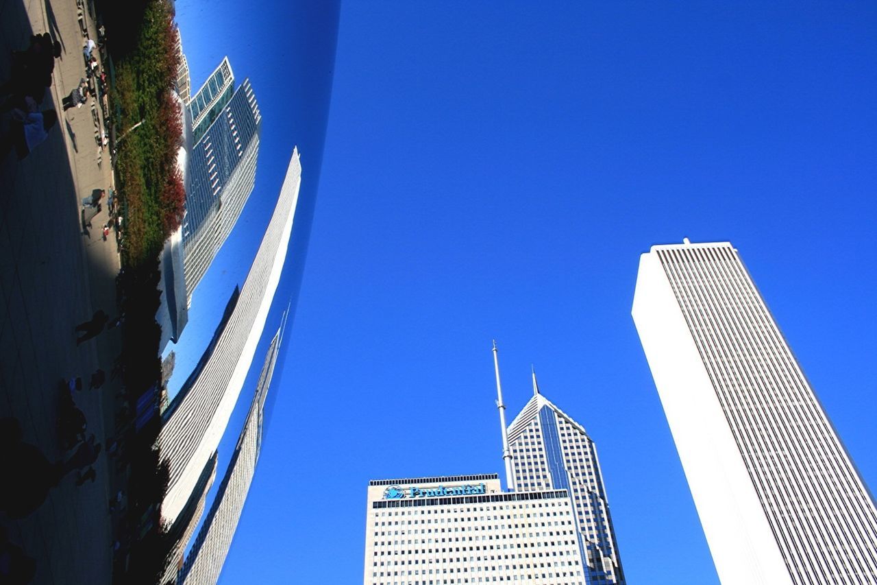 architecture, building exterior, built structure, skyscraper, city, clear sky, modern, low angle view, blue, office building, tall - high, tower, building, financial district, glass - material, copy space, city life, day, sunlight, outdoors