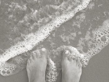 Low section of woman in water