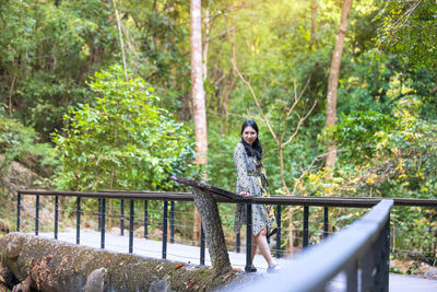 Thai woman traveler travel into amazing beautiful in tropical forest person