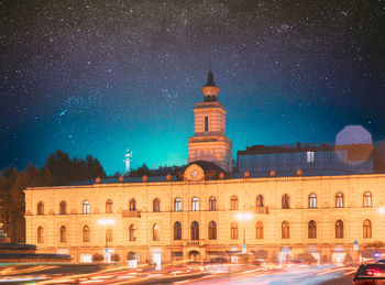 Low angle view of illuminated building against sky at night