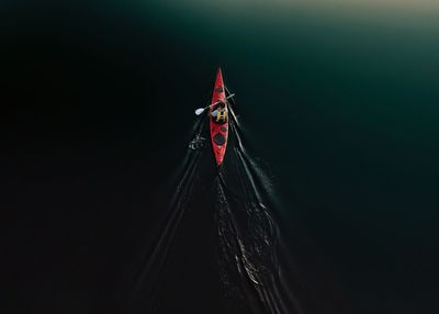 Person on illuminated red light in the dark