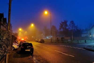 Cars on road at night