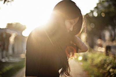 Thoughtful young woman looking away