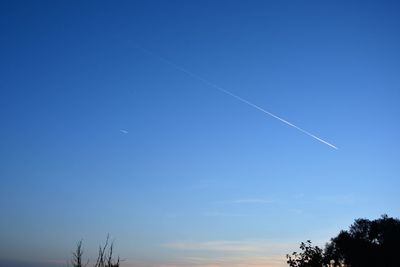 Low angle view of vapor trail in sky