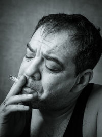 Close-up of man smoking cigarette