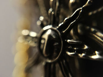 Close-up of chain on table