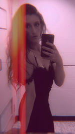 Portrait of a young woman drinking mirror