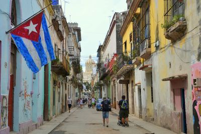 Narrow street amidst buildings in city