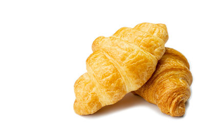 Close-up of bread on white background