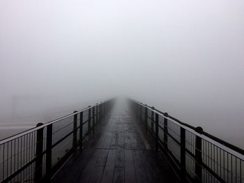 Bridge against sky during foggy weather