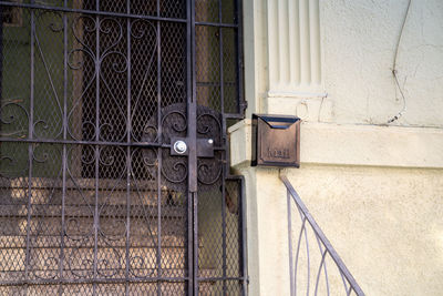 Metal gate against wall of building