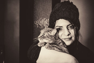 Portrait of woman with cat