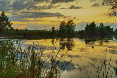 Scenic view of lake at sunset