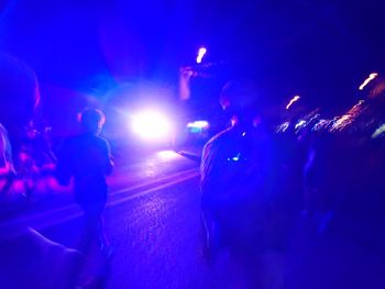 People on street at night