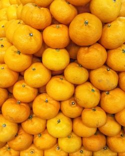 Full frame shot of oranges in market