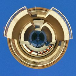 Low angle view of spiral staircase against clear blue sky