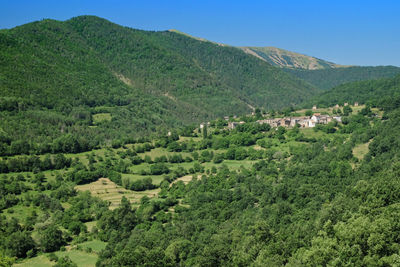 Scenic view of landscape and mountains against sky