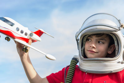 Portrait of boy with red flag