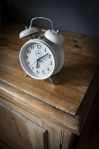 High angle view of clock on table