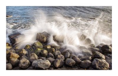 Scenic view of rocks in sea