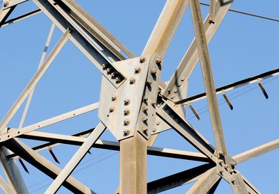 Low angle view of telephone pole against sky