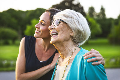 Portrait of a smiling young woman outdoors