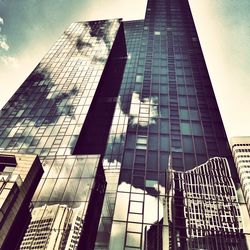 Low angle view of modern buildings against sky