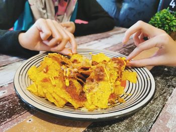 Midsection of woman having food