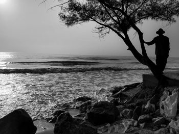 Man looking at sea against sky