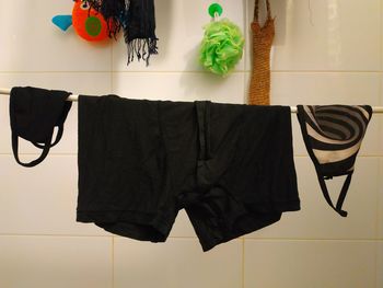 Clothes hanging on wall at home