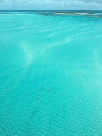Scenic view of sea against blue sky