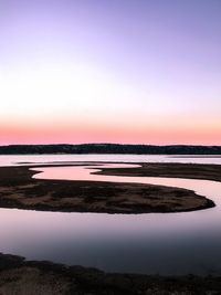 Scenic view of sea against clear sky during sunset