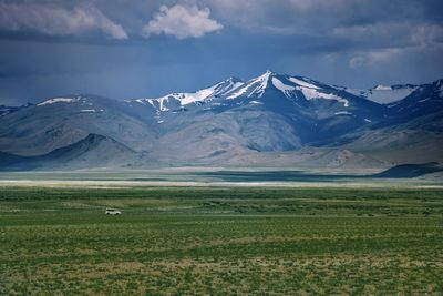 Scenic view of snowcapped mountains against sky