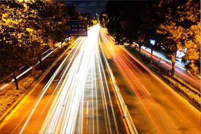 High angle view of light trails on road